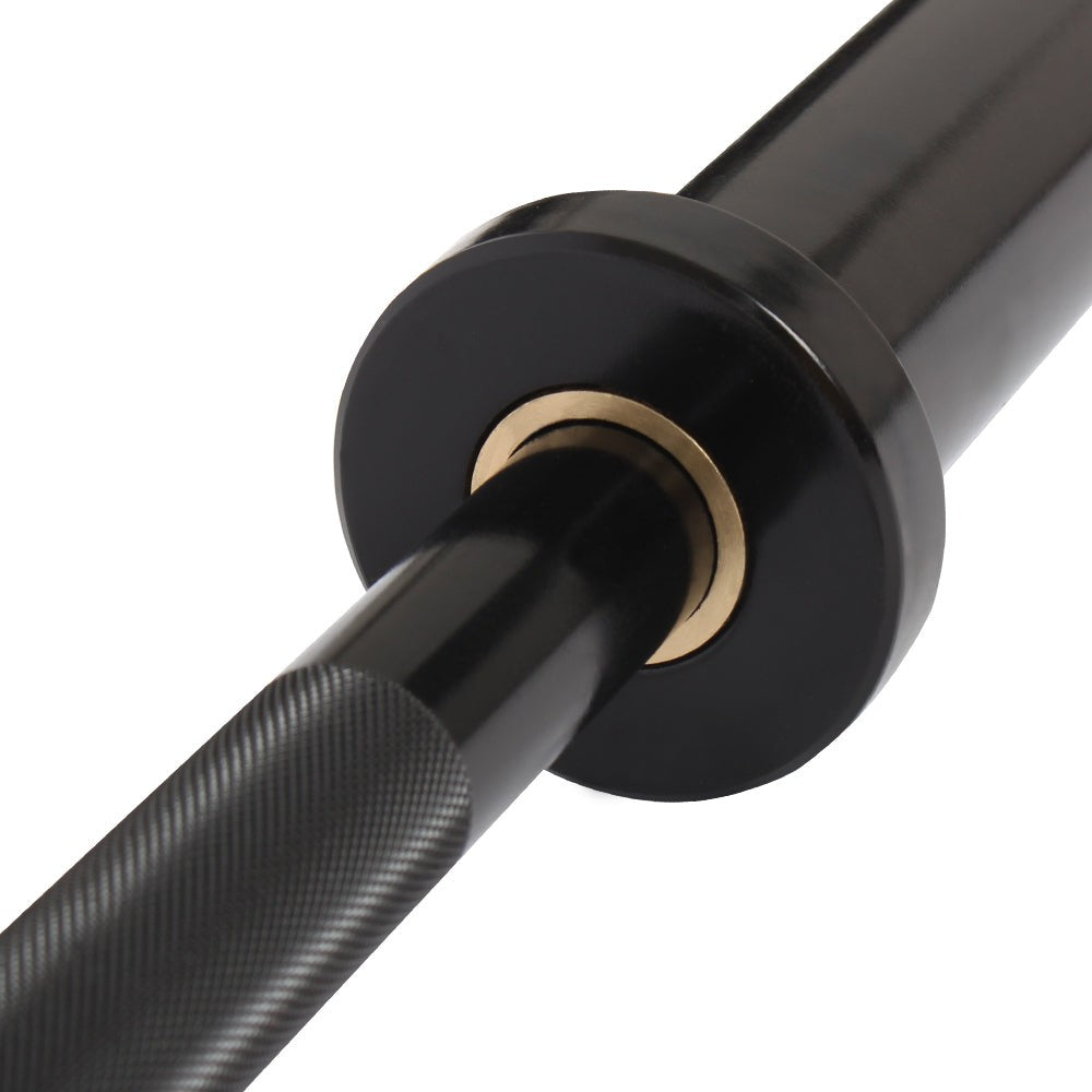 Gymless 4ft black steel training barbell with Olympic sleeve and bronze bushing detail for technique and rehab training