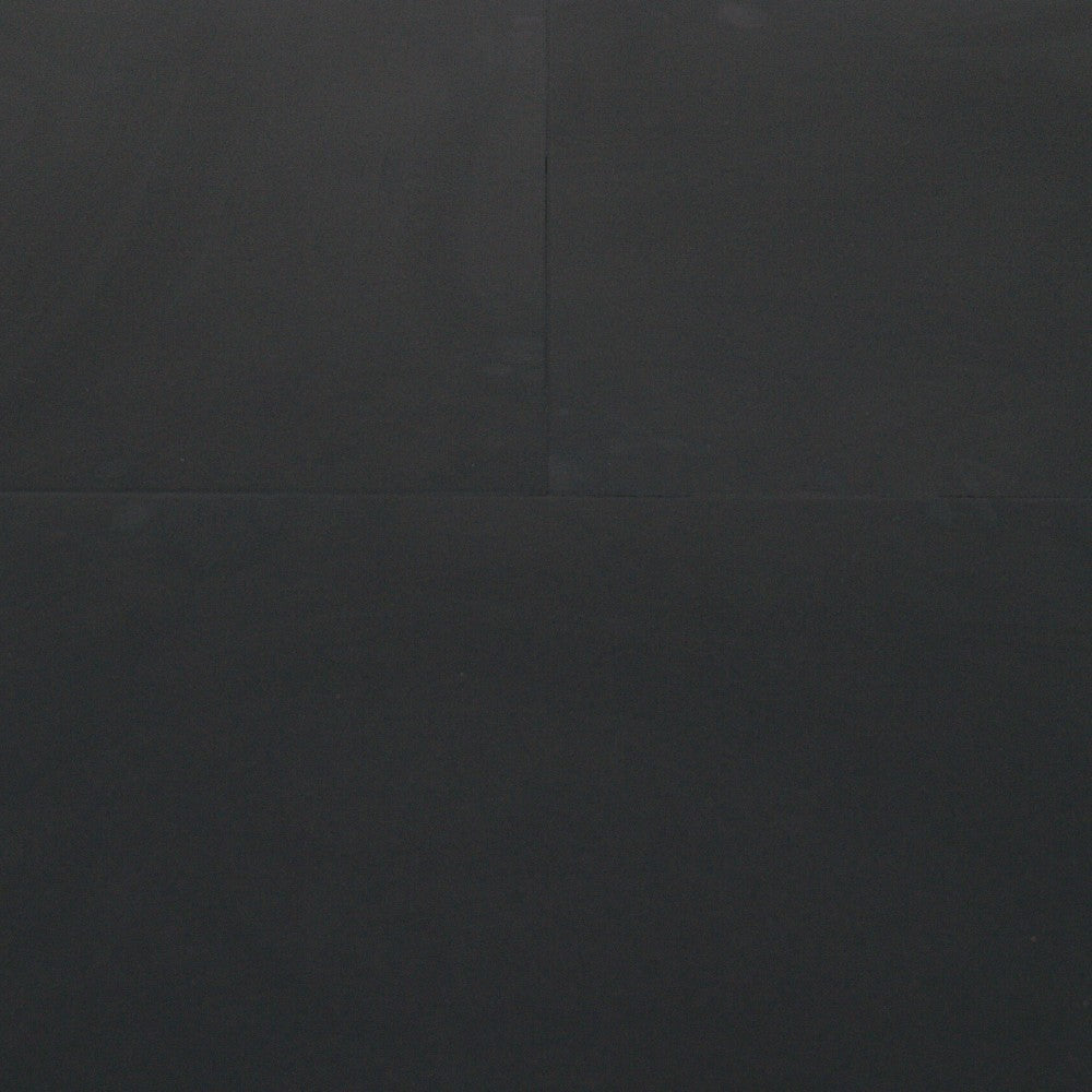Gymless premium black composite gym flooring tiles with a smooth, easy-clean laminated surface for home or commercial use