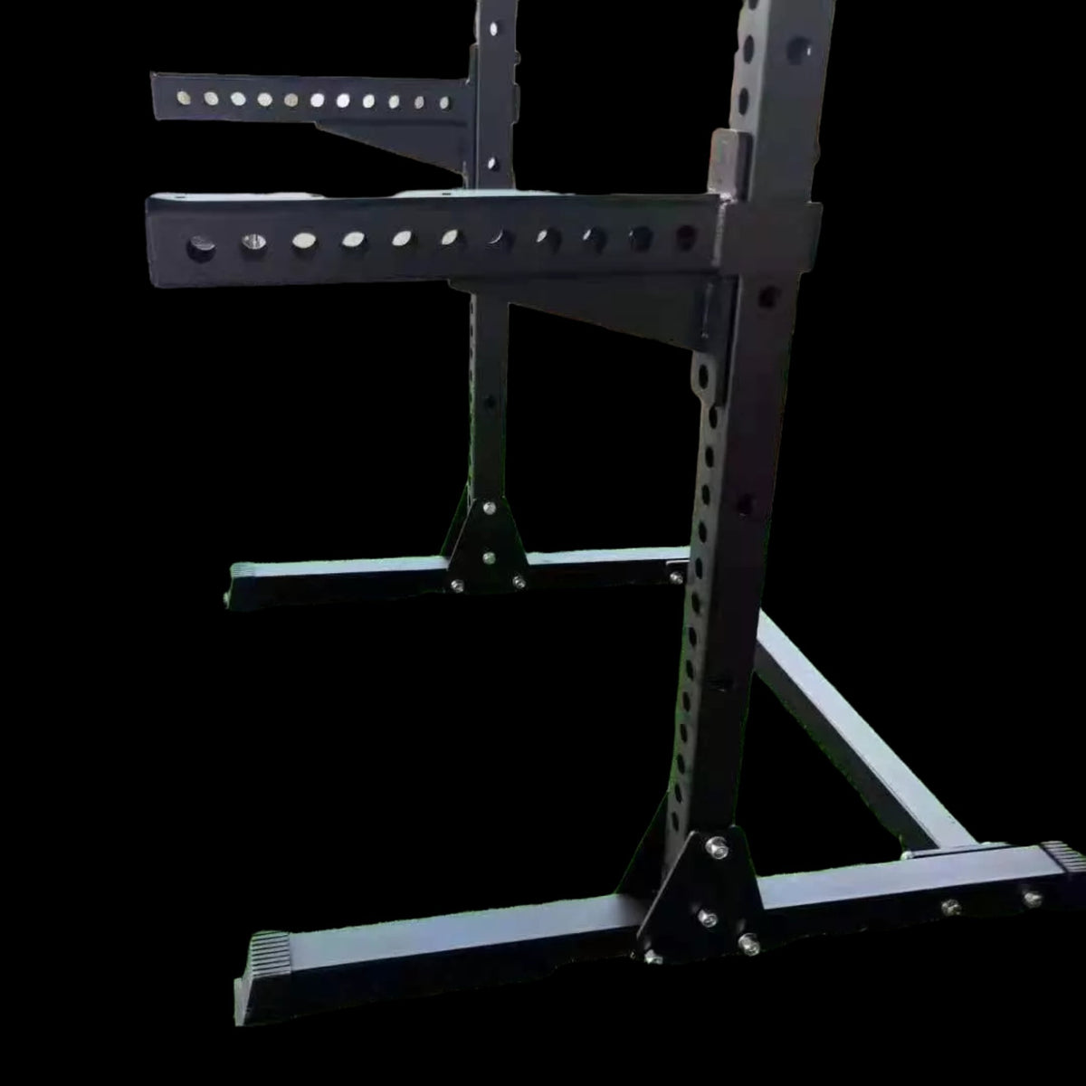 Gymless commercial half rack in black steel with heavy-duty 3mm tubing, J-hooks, and adjustable spotter arms.