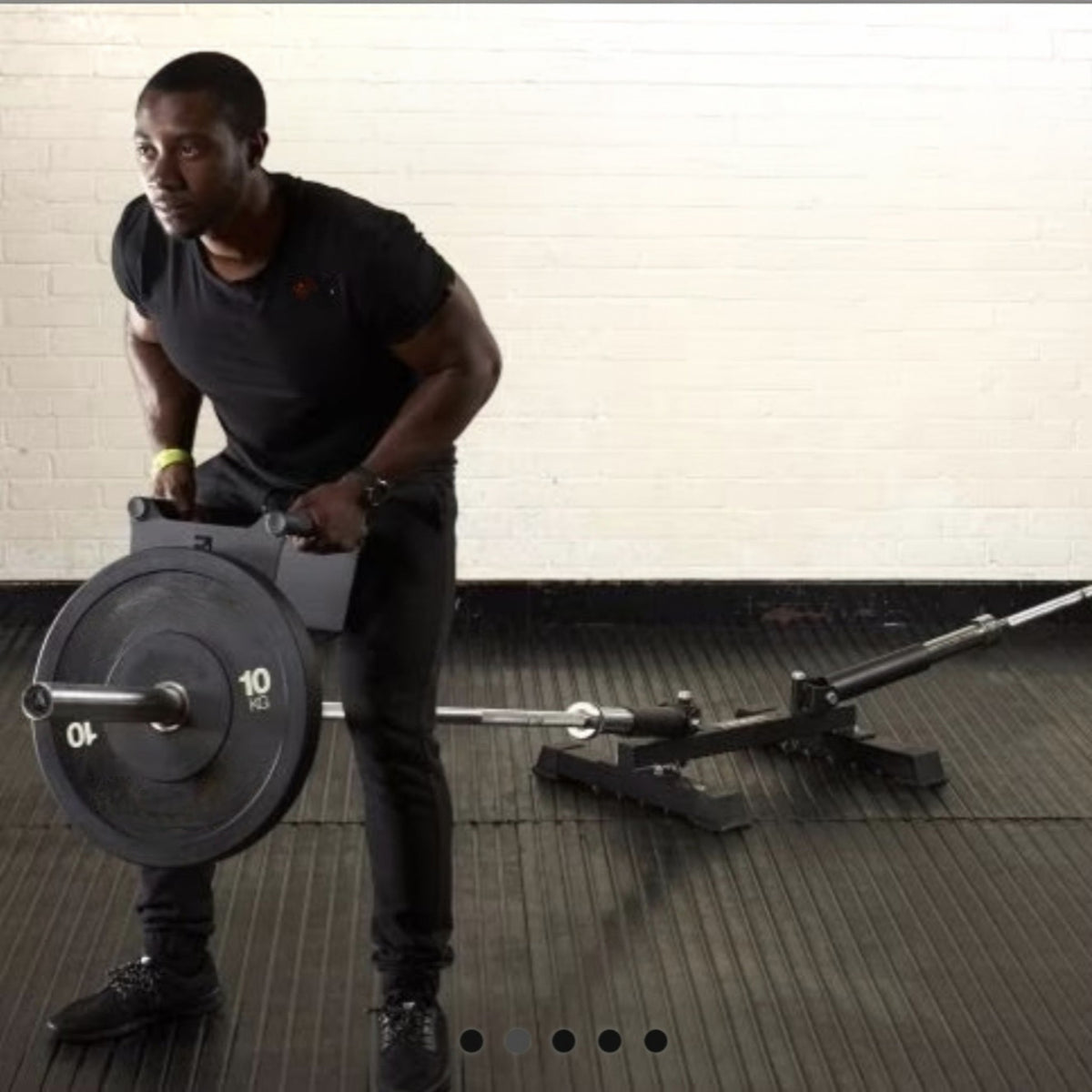 Gymless double freestanding landmine in black powder-coated steel with a user performing a barbell row exercise.