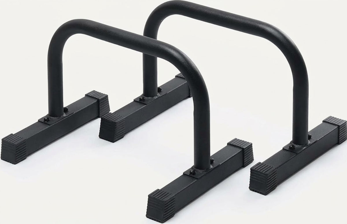 Pair of black steel Gymless parallettes with ribbed rubber feet.